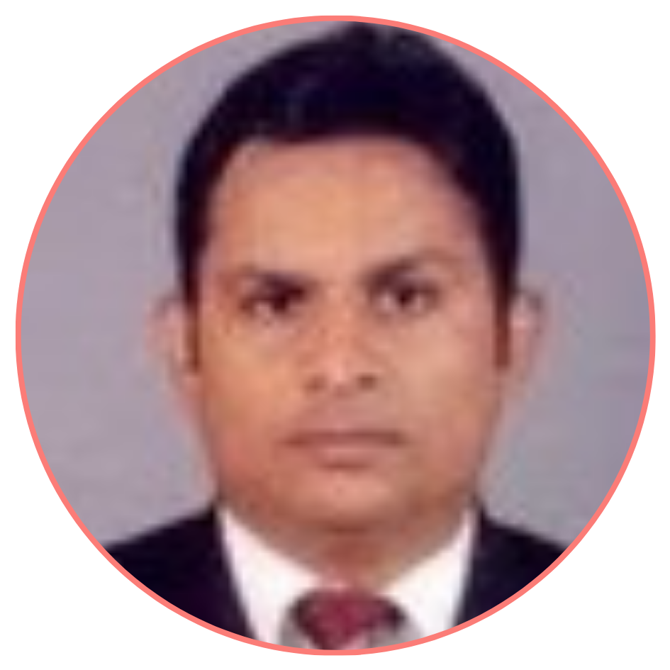 Professional passport-style portrait of a man with short black hair, wearing a dark suit and tie, set against a light gray background.