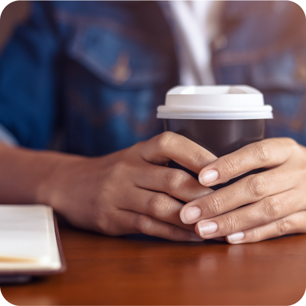 Professional reviewing ITSM notes at a table, reflecting SysAid’s streamlined ITSM solutions for efficiency. - SysAid