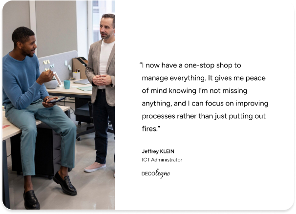 Two men discuss ITSM success in a modern office, quoting DECOlegno’s ICT admin on improved management with SysAid. - SysAid