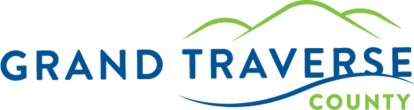 Grand Traverse County logo with blue-green text and hill, river lines; reflecting Service Desk support for public services. - SysAid