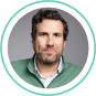 Professional man in a green jacket, representing SysAid ITSM experts ready to improve your Service Desk experience. - SysAid