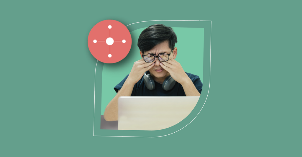 A tired professional with glasses and headphones at a laptop highlights Service Desk challenges in ITSM efficiency. - SysAid