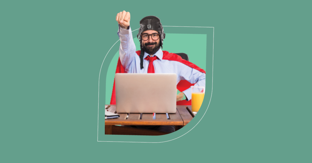 Heroic IT professional celebrates service desk success with SysAid ITSM beside a laptop and orange juice. - SysAid