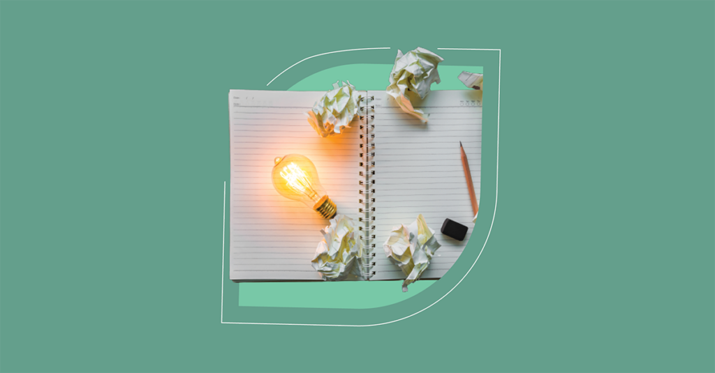 An open notebook and glowing light bulb symbolize innovation in ITSM, fuel for efficient solutions in 2023. - SysAid